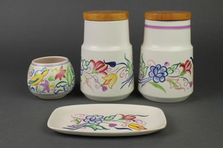 2 Poole storage jars and covers decorated with spring flowers 7", ditto squat vase 3" and a rounded rectangular dish 5" 
