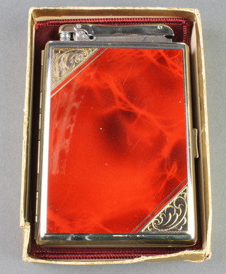 A Colibri cigarette case incorporating a cigarette lighter 