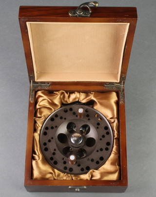 A Holland & Wilkinson Trotting 4 1/2" fishing reel in original wooden box 