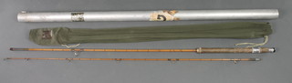 A Hardy Wanlass 9/10lb split cane spinning fishing rod with original sleeve and contained in an alloy tube