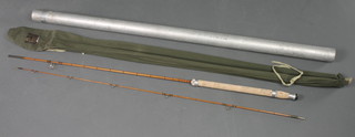 A Hardy Wanlass 4lb split cane spinning fishing rod contained in original sleeve and with alloy tube 