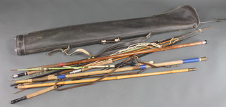 A plastic rod holdall containing a collection of mixed rod parts etc 