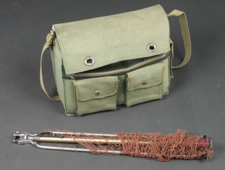 A canvas fly fishing bag with landing net, cased flies, Shakespeare Condex reel and 1 other, priest etc 