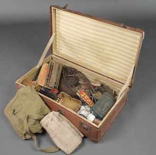 A quantity of various fishing tackles, reels etc, contained in a suitcase