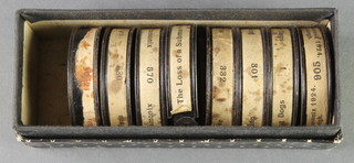 8 Pathescope film reels together with complete listing of films 