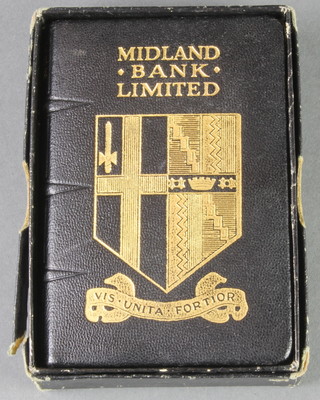 A Midland Bank money box in the form of a book
