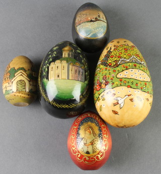A Russian lacquered egg decorated a building 4", 4 other lacquered eggs