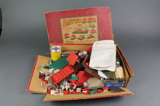 A Bayko building set with green and red parts, boxed, (box is damaged) 