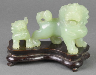 A green hardstone figure of 2 standing Dogs of Fo 3" and 4" 