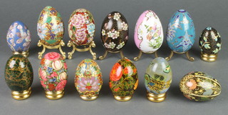 3 champleve enamelled models of eggs, 3 cloisonne ditto, 2 porcelain eggs and 5 other eggs 