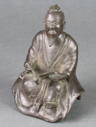 A Chinese bronze figure of a seated gentleman with book 5" 