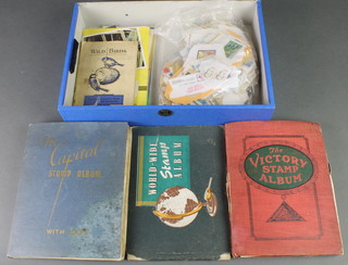 A Victory stock book of  mixed stamps, a Worldwide stamp album and a Capitol stamp album of various stamps together with loose stamps