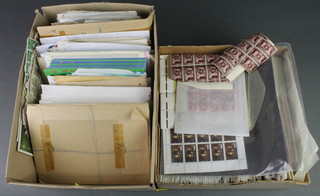 A box of first day covers and stamped envelopes and a box of loose world stamps 