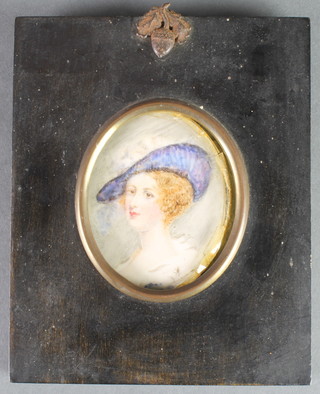 Miniature watercolour, an oval study of a lady in an ebonised and acorn mounted frame 3" x 2 1/2" 