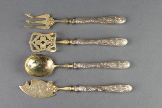 4 Continental silver handled servers comprising fork, slice, spoon and knife with gilt terminals 