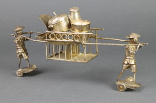 A Chinese silver novelty condiment in the form of 2 figures carrying a sedan chair 