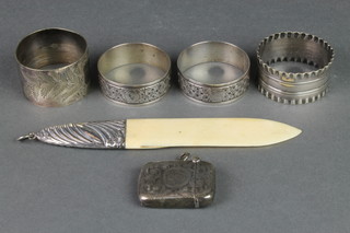 A silver mounted ivory paper knife Birmingham 1916 and a silver vesta Birmingham 1924, 4 plated napkin rings