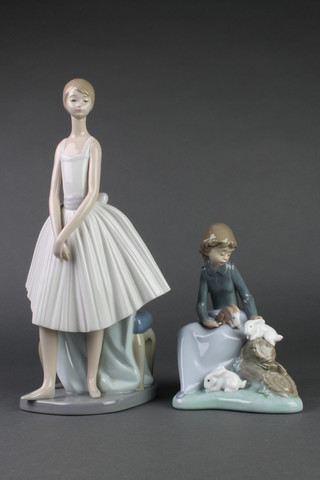 A Nao figure of a young girl with rabbits 7" and a ditto figure of a standing ballerina 12 1/2" 