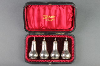 A cased set of Victorian silver baluster pepperettes, Sheffield 1897