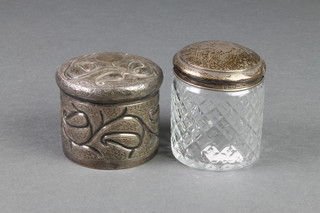 A Persian silver repousse box and a silver mounted toilet jar 