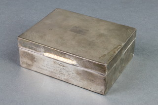 A silver rectangular engine turned cigarette box 