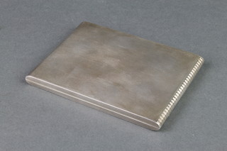 A silver engine turned cigarette case with patent action, Sheffield 1948, 230 grams