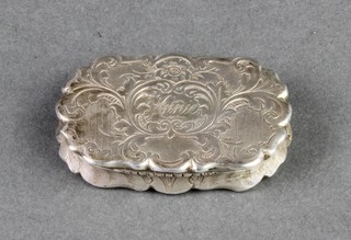 A Victorian rounded rectangular silver vinaigrette with chased scroll decoration and floral grill 1 1/2" 