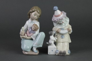 A Lladro figure of a young girl brushing a dolls hair. 5990 6" and a ditto of a child clown playing a concertina 5279 6" 