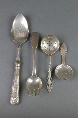 A silver caddy spoon with simple decoration, a sifter spoon, a fork and preserve spoon