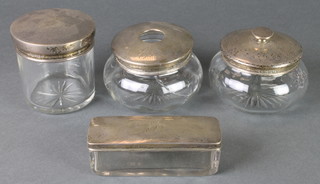 A 4 piece silver mounted dressing table set comprising 2 lidded jars, a hair tidy and a box, Birmingham 1919/22/23/28 