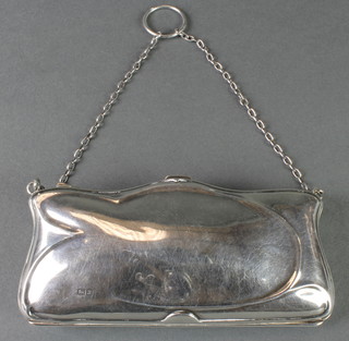 A repousse silver purse with leather interior, Chester 1918 