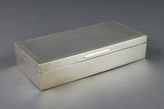An Art Deco rectangular silver cigarette case, Birmingham 1934 