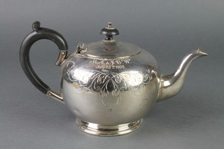 A silver plated globular teapot with ebony mounts