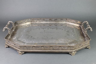 A good Victorian silver plated 2 handled octagonal tray with pierced decoration and mask mounts on scroll feet