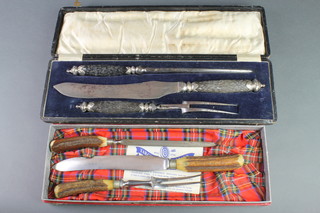 A cased antler handled carving set and 1 other 
