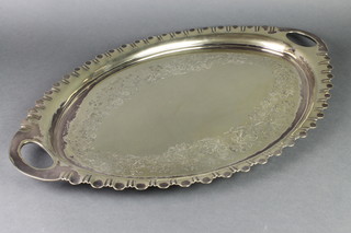 An Edwardian silver plated chased 2 handled tray 