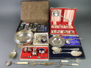A pair of silver plated cased berry spoons, a quantity of plated items