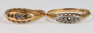 2 18ct gold gem set rings, size P and U, 6 grams