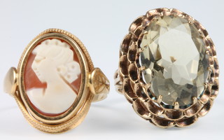 A 9ct yellow gold cameo ring and a quartz ditto, size K 1/2 and Q