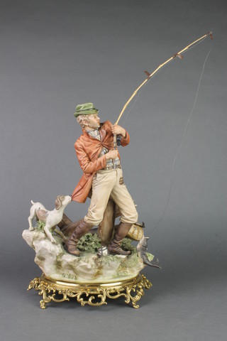 A Capodimonte figure of a fisherman on a gilt metal base 14" 