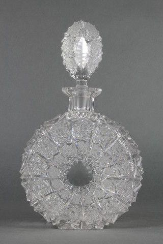A circular flattened cut glass spirit decanter and stopper 10 1/2" 