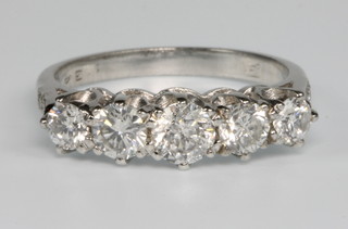 An 18ct white gold 5 stone diamond ring, approx. 1.34ct, size N 1/2