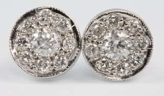 A pair of 18ct white gold diamond cluster ear studs, approx .7ct 