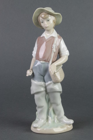 A Lladro figure of a fishing boy 5" 