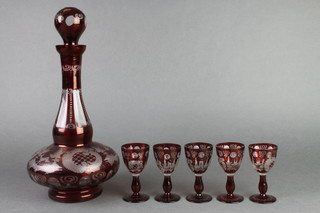 An early 20th Century flash glass decanter and 5 liqueurs decorated with birds and flowers and pavillions 