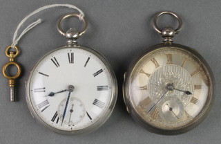 A silver pocket watch with champagne dial and seconds at 6 o'clock and a plain ditto 