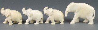 A family of 4 carved ivory elephants