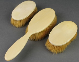 A 3 piece ivory backed brush set 