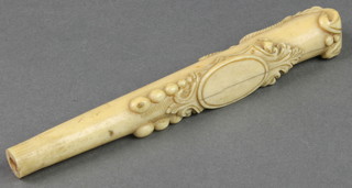An Edwardian carved ivory parasol handle with vacant cartouche 