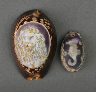 A carved conch shell with lion mask 2 1/2", a ditto with a seahorse 1 1/2" 